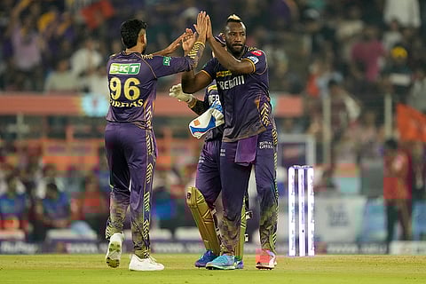 Andre Russell celebrates Pat Cummins's wicket